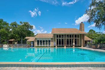 Swimming Pool with Clubhouse in Background at Whisper Lake Apartments, Winter Park, 32792